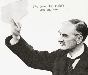 Neville Chamberlain holds the paper signed by both Hitler and himself on his return from Munich to Heston Aerodrome Neville Chamberlain holds the paper signed by both Hitler and himself on his return from Munich to Heston Aerodrome