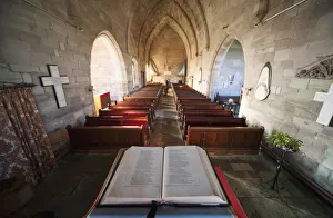 Northumberland, England; An Open Bible At The Back Of A Church Northumberland, England; An Open Bible At The Back Of A Church