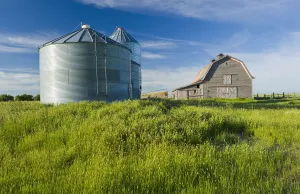 Old Barn With Metal Grain Bins; Ponteix Saskatchewan Canada Old Barn With Metal Grain Bins; Ponteix Saskatchewan Canada