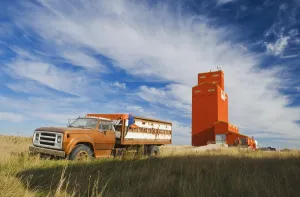 Old Farm Truck And Grain Elevator; Stoughton Saskatchewan Canada Old Farm Truck And Grain Elevator; Stoughton Saskatchewan Canada