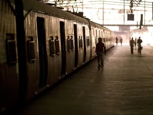 Passengers And Trains In A Train Station; Mumbai, India Passengers And Trains In A Train Station; Mumbai, India