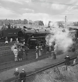 People standing and viewing the steam engine Evening Star on an open day; England People standing and viewing the steam engine Evening Star on an open day; England