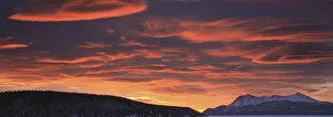 Red Lenticular Clouds Over Teslin Lake And Dawson Peaks At Sunrise, Teslin, Yukon Red Lenticular Clouds Over Teslin Lake And Dawson Peaks At Sunrise, Teslin, Yukon