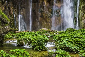 Rushing water of the large waterfall at Plitvice Lakes National Park in Lika-Senj county in Croatia Rushing water of the large waterfall at Plitvice Lakes National Park in Lika-Senj county in Croatia
