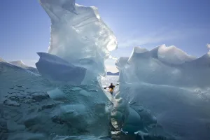 Sea Kayaker Views Large Icebergs In Stephens Passage On A Warm Summer Afternoon, Tracy Arm-Fords Terror Wilderness Sea Kayaker Views Large Icebergs In Stephens Passage On A Warm Summer Afternoon, Tracy Arm-Fords Terror Wilderness