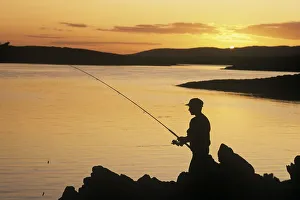 Silhouette Of A Fisherman Fishing On The Coast, Roaring Water Bay, County Cork, Republic Silhouette Of A Fisherman Fishing On The Coast, Roaring Water Bay, County Cork, Republic