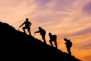 Silhouette Of Four Mountian Climbers As They Ascend Mount Ascension Before Sunrise Silhouette Of Four Mountian Climbers As They Ascend Mount Ascension Before Sunrise