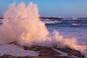Strong Winds Blow Waves Onto Rocks In Front Of Lighthouse At Peggys Cove, Nova Scotia Strong Winds Blow Waves Onto Rocks In Front Of Lighthouse At Peggys Cove, Nova Scotia