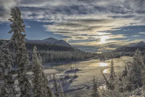 The Sun Breaks Through The Clouds Above The Takhini River On A Late Winter Afternoon The Sun Breaks Through The Clouds Above The Takhini River On A Late Winter Afternoon