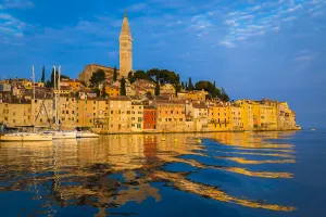 Sun reflecting on the buildings of the fishing port city of Rovinj on the north Adriatic Sea in Istria, Croatia Sun reflecting on the buildings of the fishing port city of Rovinj on the north Adriatic Sea in Istria, Croatia
