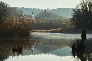 Sunrise and mist over billabong in River Danube with village church, Tegernheim, Bavaria, Germany Sunrise and mist over billabong in River Danube with village church, Tegernheim, Bavaria, Germany