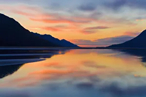 Sunset Colors Reflected In The Waters Of Turnagain Arm During Fall In Southcentral Alaska Sunset Colors Reflected In The Waters Of Turnagain Arm During Fall In Southcentral Alaska