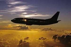 USA, Silhouette of airplane in sunset sky; Hawaii USA, Silhouette of airplane in sunset sky; Hawaii