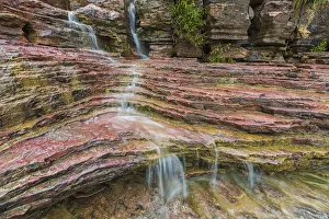 Water Flows Over A Very Colourful Waterfall In The Heart Of Toro Toro National Park; Bolivia Water Flows Over A Very Colourful Waterfall In The Heart Of Toro Toro National Park; Bolivia