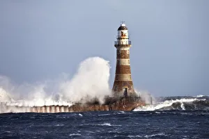 Waves Crashing Against Roker Lighthouse; Sunderland, Tyne And Wear, England Waves Crashing Against Roker Lighthouse; Sunderland, Tyne And Wear, England