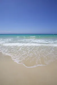White Sand Island Beach With Crystal Clear Turquoise Water And Blue Sky White Sand Island Beach With Crystal Clear Turquoise Water And Blue Sky