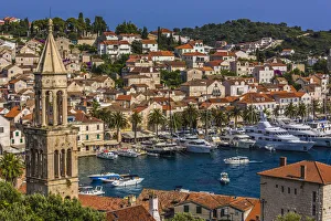 Yachts in the marina at the Old Town of Hvar with St Mark's Chruch bell tower (left) on Hvar Island, Croatia Yachts in the marina at the Old Town of Hvar with St Mark's Chruch bell tower (left) on Hvar Island, Croatia