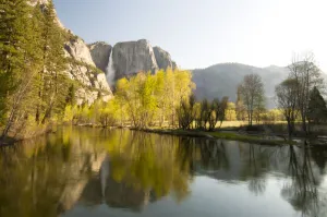 Yosemite Falls and autumn foliage reflected in Merced River, Yosemite National Park, California, USA Yosemite Falls and autumn foliage reflected in Merced River, Yosemite National Park, California, USA