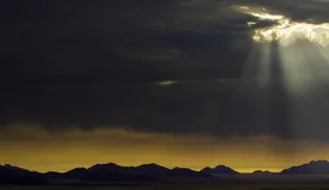 The Sun Breaks Through Clouds Print