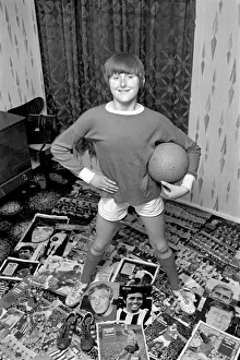 14-year-old Susan Lee surrounded by pictures of her favourite soccer stars wearing her 14-year-old Susan Lee surrounded by pictures of her favourite soccer stars wearing her