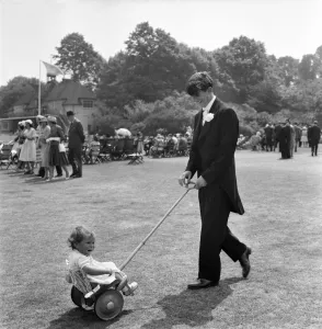 15 year old Hugh Pryor the Eton Boy from Reading with 12 months old Isabel his niece in 15 year old Hugh Pryor the Eton Boy from Reading with 12 months old Isabel his niece in