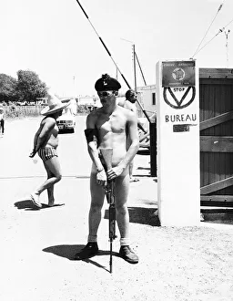 One of 1st Battalion Royal Irish Rangers on guard at the gates of the nudist camp next to One of 1st Battalion Royal Irish Rangers on guard at the gates of the nudist camp next to