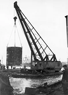 250 ton crane lifting a new turbine for Deptford Power Station. 29th April 1949 250 ton crane lifting a new turbine for Deptford Power Station. 29th April 1949