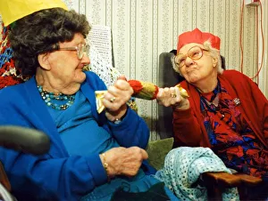 97 year olds Alison Lewis and Elizabeth Llewellyn pulling a cracker November 97 year olds Alison Lewis and Elizabeth Llewellyn pulling a cracker November