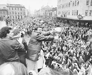 Aberdeen manager Alex Ferguson holding the European Cup Winners Cup trophy to crowded Aberdeen manager Alex Ferguson holding the European Cup Winners Cup trophy to crowded