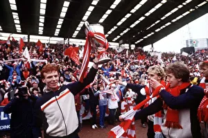 Aberdeen's Alex McLeish holding the European Cup Winners Cup trophy aloft for fans Aberdeen's Alex McLeish holding the European Cup Winners Cup trophy aloft for fans