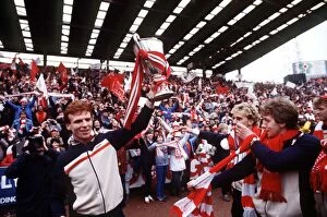 Images Dated 12th May 1983: Aberdeens Alex McLeish holds the European Cup Winners Cup trophy for fans at