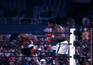 Action during the heavyweight world title fight between Muhammad Ali Action during the heavyweight world title fight between Muhammad Ali