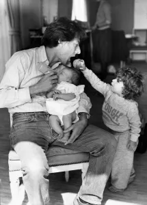 Actor Dustin Hoffman seen here feeding his five week old daughter Rebecca whilst being Actor Dustin Hoffman seen here feeding his five week old daughter Rebecca whilst being