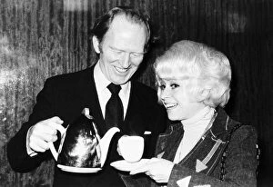 Images Dated 11th February 1976: Actor Gordon Jackson pours tea for Barbara Windsor 1976