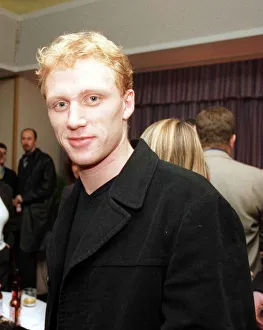 Actor Kevin McKidd wearing black jacket, in a room full of people Actor Kevin McKidd wearing black jacket, in a room full of people