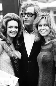 Actor Michael Caine and actress Suzanne Leigh photographed with competition winner Actor Michael Caine and actress Suzanne Leigh photographed with competition winner