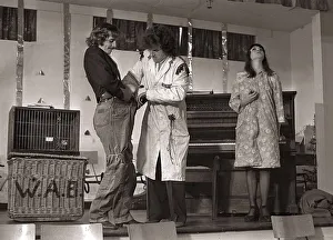 Actor Sylvester McCoy seen here having a ferret put down his trousers whilst on stage Actor Sylvester McCoy seen here having a ferret put down his trousers whilst on stage