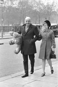Actor Telly Savalas walking arm in arm in London with his wife, Marilynn Gardner Actor Telly Savalas walking arm in arm in London with his wife, Marilynn Gardner