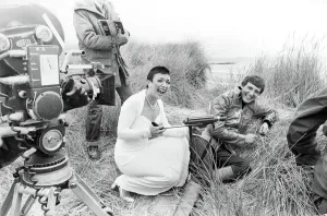 Actress Jacqueline Pearce as Servalan and Paul Darrow as Avon share a joke during filming Actress Jacqueline Pearce as Servalan and Paul Darrow as Avon share a joke during filming