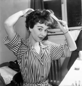 Actress Joan Griffiths fixing her hair in her dressing room before going on stage Actress Joan Griffiths fixing her hair in her dressing room before going on stage