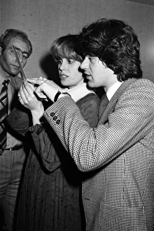 Actress Joanna Lumley judging a Purdey haircut lookalike contest with hairdresser John Actress Joanna Lumley judging a Purdey haircut lookalike contest with hairdresser John