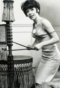 Actress Katy Wild beating an old African drum which is made into a chair A© Mirrorpix Actress Katy Wild beating an old African drum which is made into a chair A© Mirrorpix