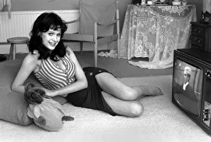 Actress Madeline Smith watching television at her flat in Kew. 6th September 1974 Actress Madeline Smith watching television at her flat in Kew. 6th September 1974