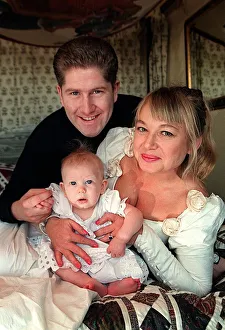 Actress Nicola Duffett with husband Ian Henderson 1995 and baby at home Actress Nicola Duffett with husband Ian Henderson 1995 and baby at home