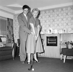 Actress and singer Jill Day seen here getting a golf lesson Circa 1957 Actress and singer Jill Day seen here getting a golf lesson Circa 1957