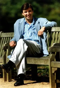 Adrian Mills TV Presenter/Actor Sitting on park bench Dbase A©Mirrorpix Adrian Mills TV Presenter/Actor Sitting on park bench Dbase A©Mirrorpix