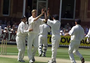 Alan Mullally celebrates with Mark Ramprakesh July 1999 (left Alan Mullally celebrates with Mark Ramprakesh July 1999 (left