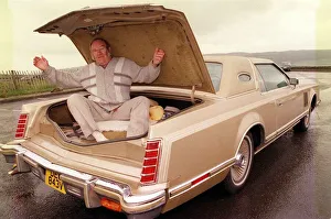 Alan Robertson sitting inside boot of his Lincoln Continental June 1999 Alan Robertson sitting inside boot of his Lincoln Continental June 1999
