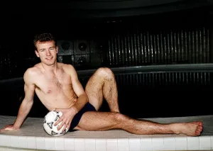 Alan Shearer Footballer relaxing by swimming pool with a football in his hand Dbase Alan Shearer Footballer relaxing by swimming pool with a football in his hand Dbase