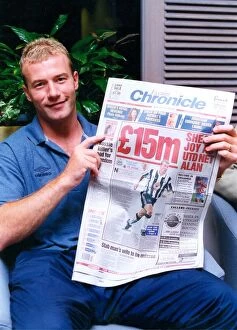 Images Dated 29th July 1996: Alan Shearer making the news after signing for his boyhood club Newcastle United